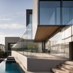 Glass railings and large fixed windows for modern homes