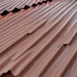 How to properly attach corrugated sheeting to the roof with screws: detailed instructions